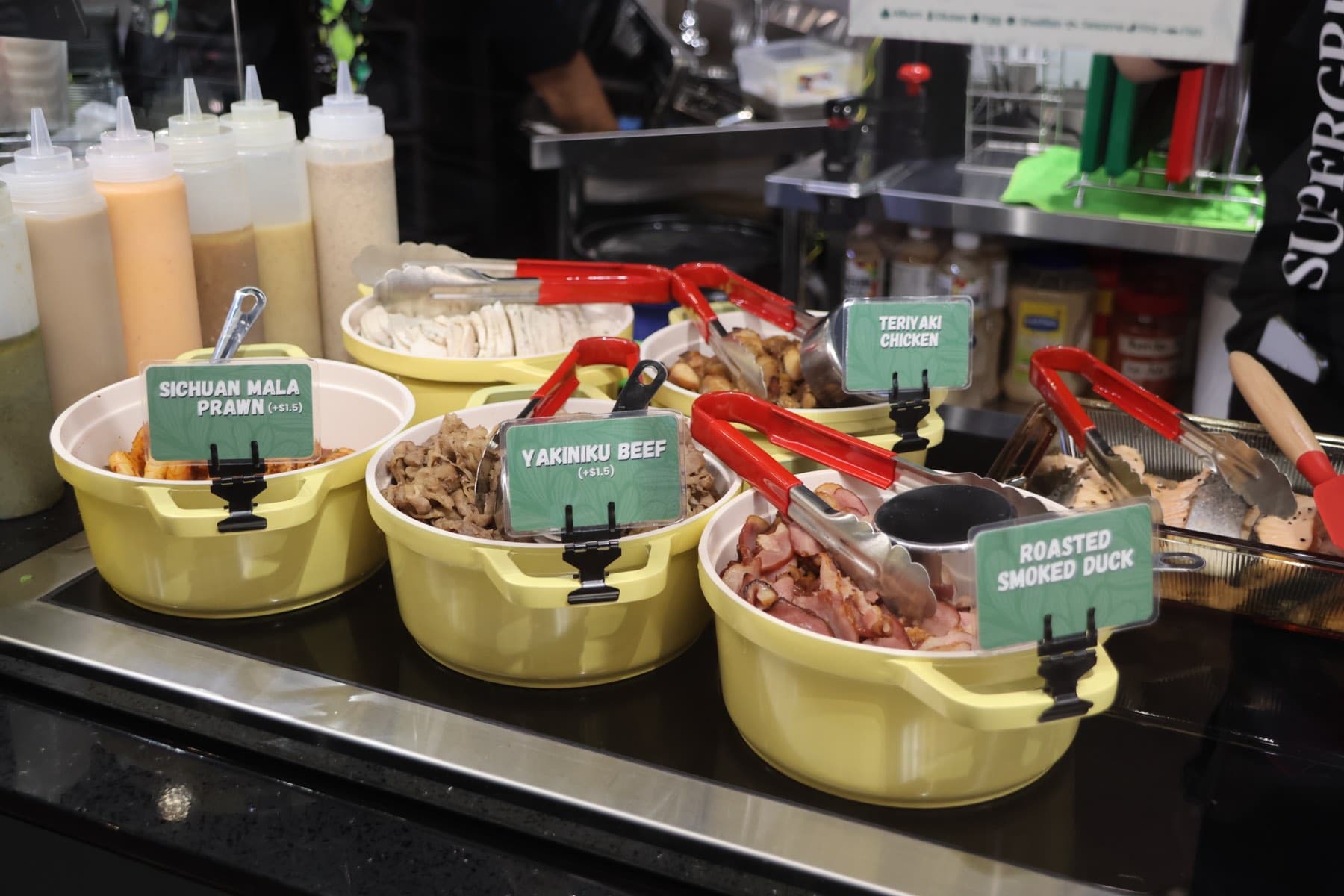 Roasted baby corn, roasted sweet potato, and chickpea relish in the Supergreen topping display